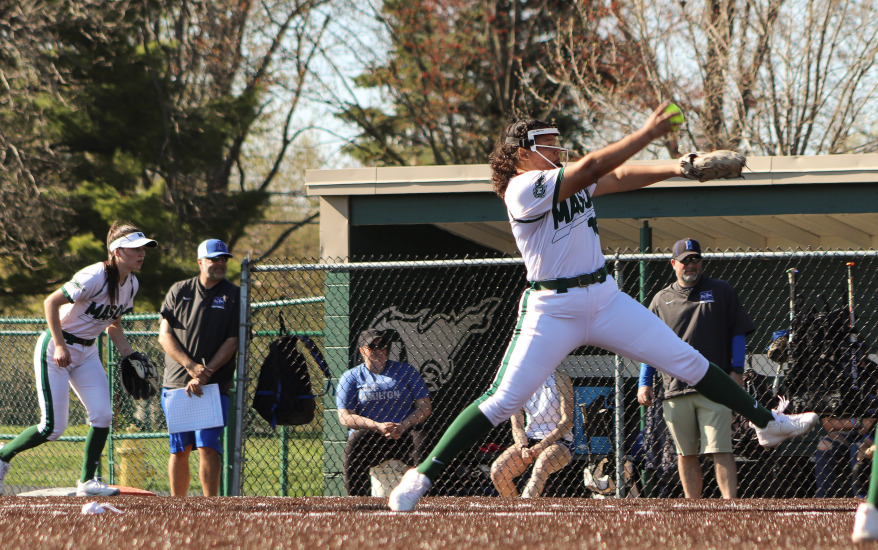 girl on base and one girl pitching